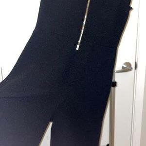 Womens medium black romper with ruffled short sleeves in good condition